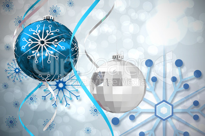 Composite image of hanging christmas bauble decorations