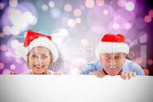 Composite image of festive couple showing poster