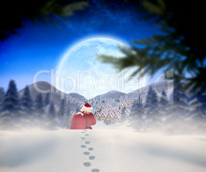 Composite image of santa walking in the snow