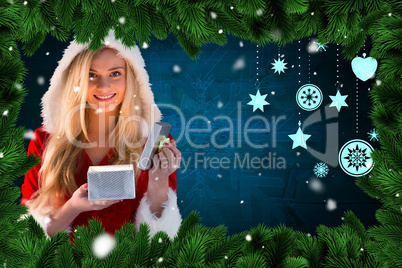 Composite image of sexy santa girl opening gift