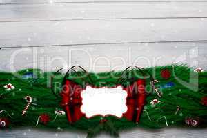 Composite image of fir branch christmas decoration garland