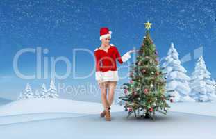 Composite image of pretty santa girl presenting with hand