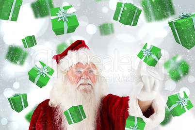 Composite image of santa claus pointing