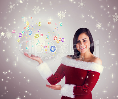 Composite image of pretty girl presenting in santa outfit