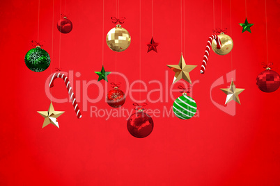 Composite image of digitally generated hanging christmas decorat