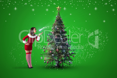 Composite image of pretty girl in santa outfit blowing