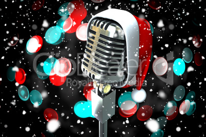 Composite image of microphone with santa hat