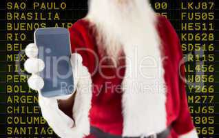 Composite image of santa claus showing smartphone