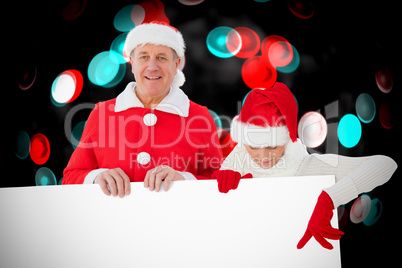 Composite image of festive couple showing poster