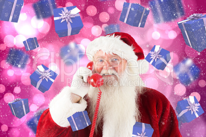 Composite image of santa claus on the phone