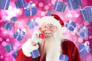 Composite image of santa claus on the phone