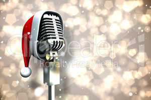 Composite image of microphone with santa hat