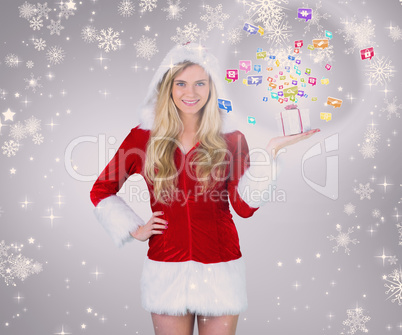 Composite image of pretty girl in santa outfit holding gift