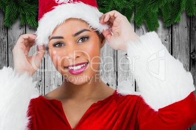 Composite image of pretty santa girl