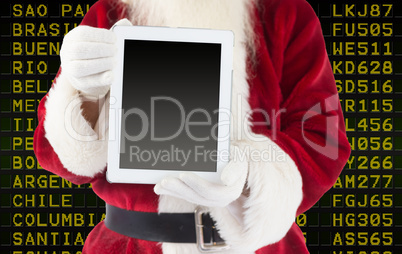 Composite image of santa claus showing tablet pc