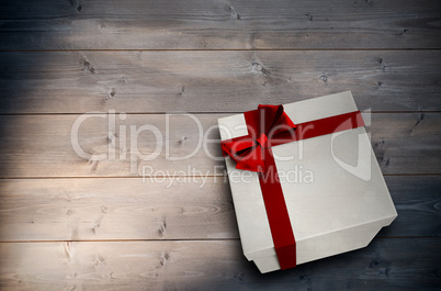 Composite image of christmas present with bow