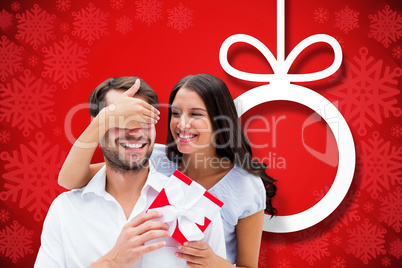 Composite image of woman surprising boyfriend with gift