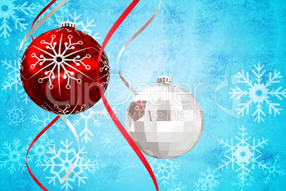 Composite image of hanging christmas bauble decorations