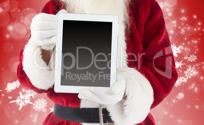 Composite image of santa claus showing tablet pc