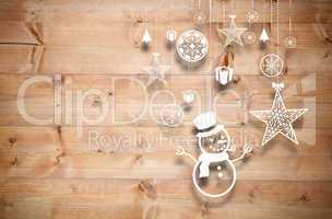 Composite image of hanging christmas decorations