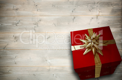 Composite image of christmas present with bow