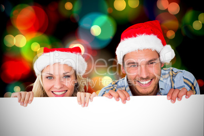 Composite image of young festive couple Composite image of young festive couple