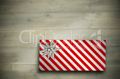 Composite image of christmas present with bow