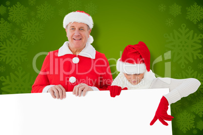 Composite image of festive couple showing poster