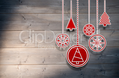 Composite image of hanging red christmas decorations