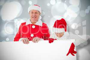 Composite image of festive couple showing poster