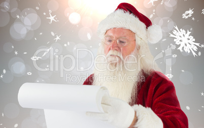 Composite image of santa claus checking his list