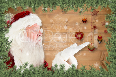 Composite image of santa claus blowing