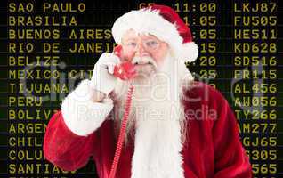 Composite image of santa claus on the phone