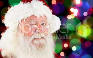 Composite image of santa claus winking