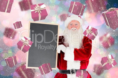 Composite image of santa claus showing blackboard