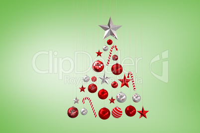 Composite image of christmas tree shape of baubles