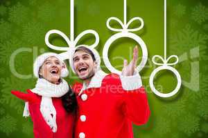 Composite image of festive young couple