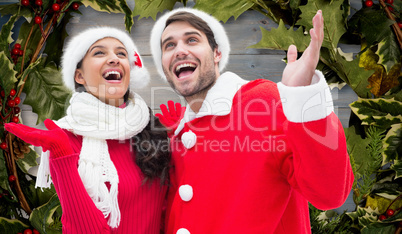 Composite image of festive young couple