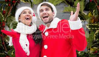 Composite image of festive young couple