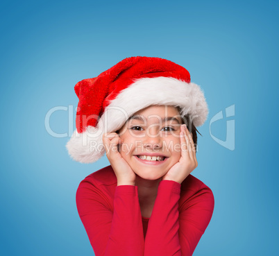 Composite image of festive little girl smiling at camera