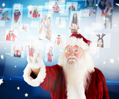 Composite image of santa pointing to christmas people collage