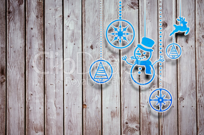 Composite image of hanging christmas decorations