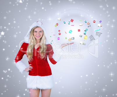 Composite image of pretty girl presenting in santa outfit