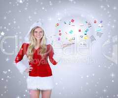 Composite image of pretty girl presenting in santa outfit