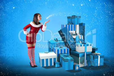 Composite image of pretty girl in santa outfit blowing