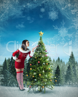 Composite image of pretty girl in santa outfit blowing