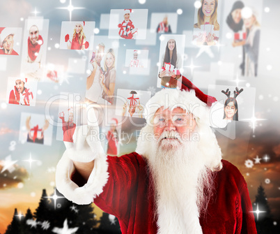 Composite image of santa pointing to christmas people collage