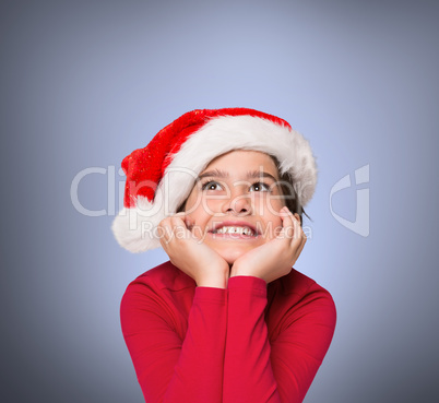 Composite image of festive little girl smiling and looking up