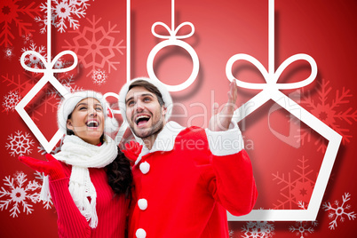 Composite image of festive young couple