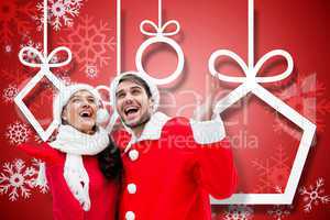 Composite image of festive young couple